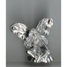 winged fairy with crossed legs